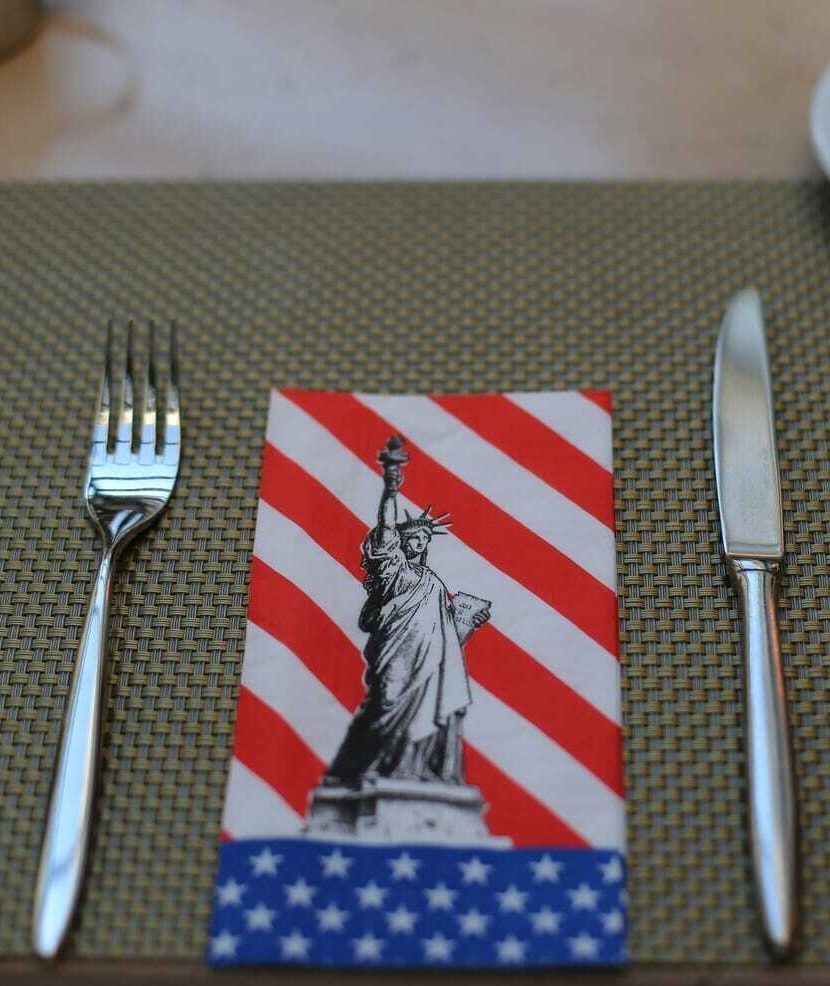 Enjoying a 4th of July dinner outdoors with patriotic decor