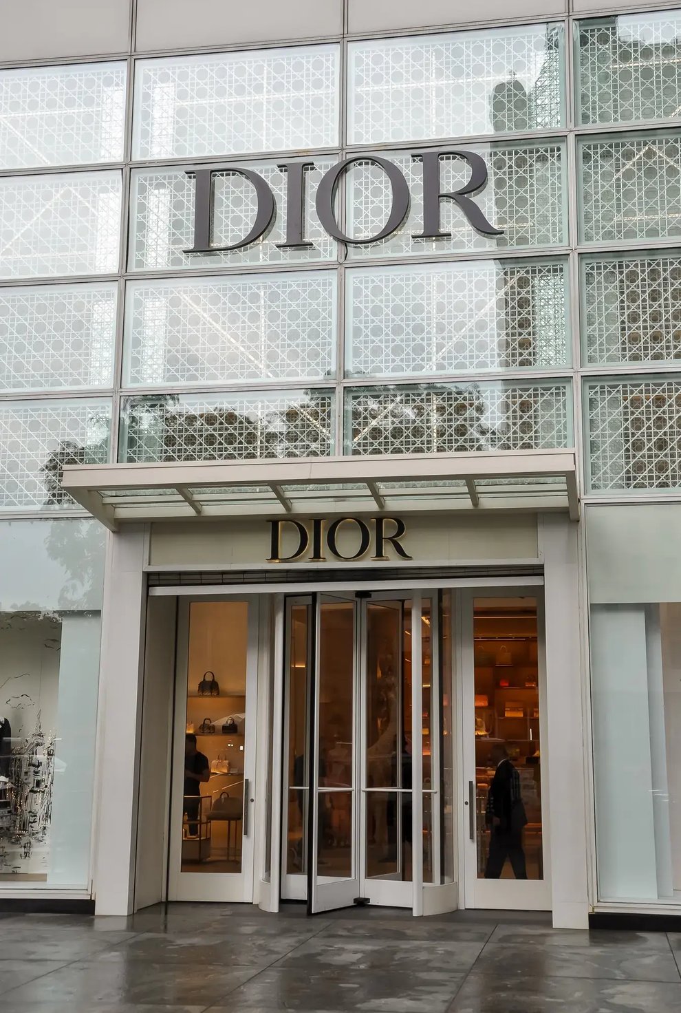 The storefront of a Dior luxury boutique.