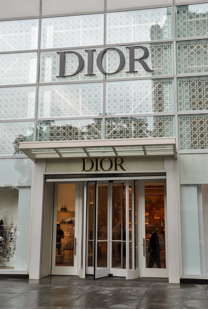 The storefront of a Dior luxury boutique.