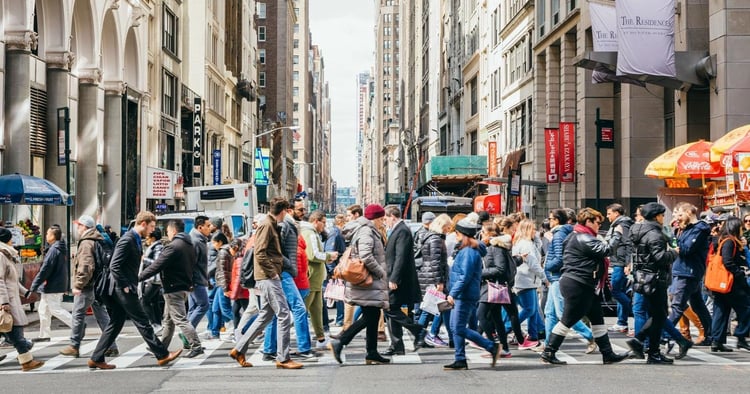 People are crossing the street in garment district