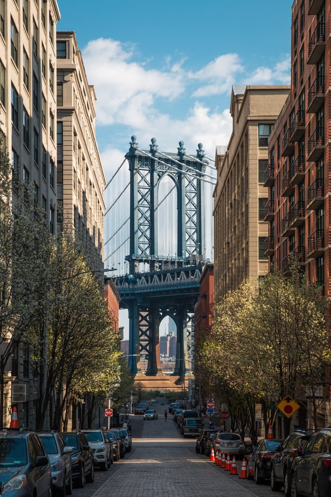 Brooklyn Bridge between Manhattan buildings